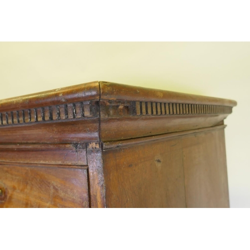 1092 - A George III mahogany chest on chest, the upper section with dentil cornice over two + three drawers... 