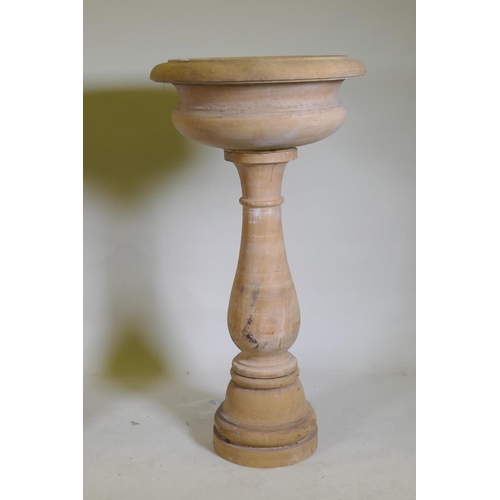 1096 - A pair of stone urns/planters raised on baluster columns, 60cm diameter, 111cm high