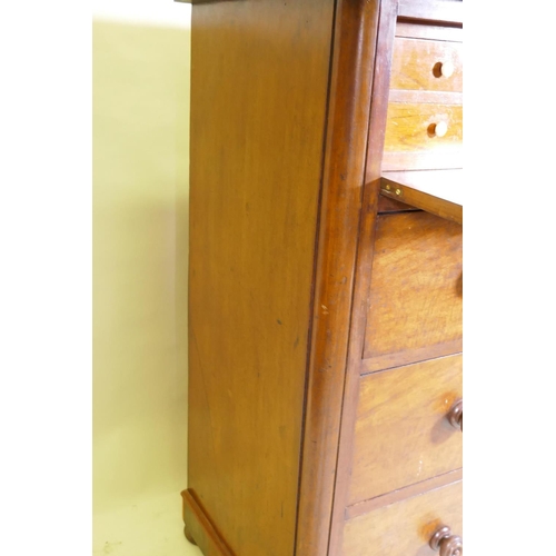 1101 - A Victorian mahogany dressing chest, the upper drawer with full front revealing four drawers flankin... 