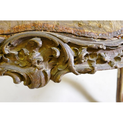 1102 - An C18th/C19th walnut window seat of serpentine form, with all over carved rococo decoration, 103 x ... 