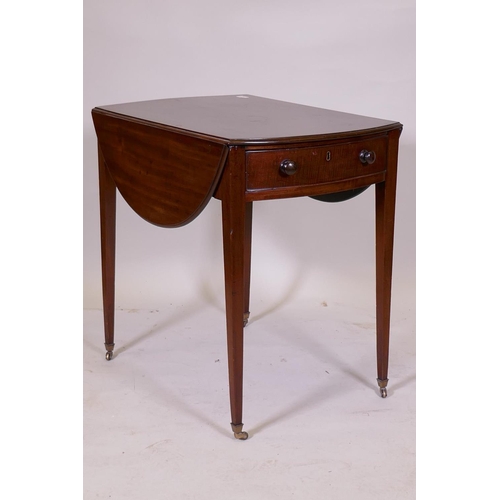 1104 - A George III mahogany Pembroke table with single drawer and bow ends, raised on square tapering supp... 