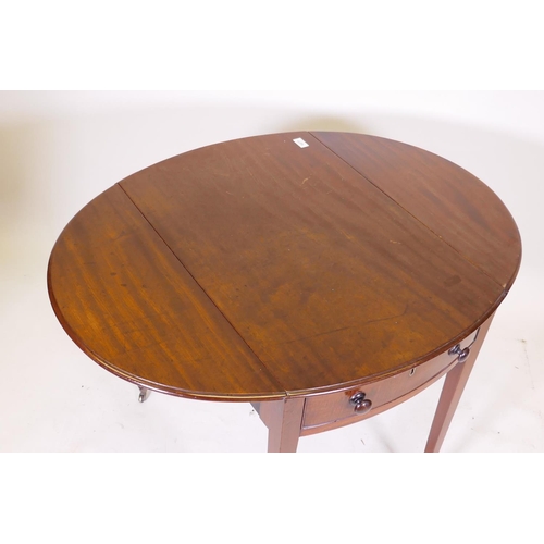 1104 - A George III mahogany Pembroke table with single drawer and bow ends, raised on square tapering supp... 