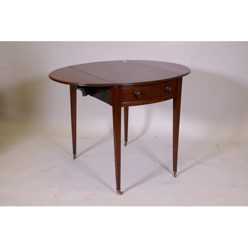 1104 - A George III mahogany Pembroke table with single drawer and bow ends, raised on square tapering supp... 