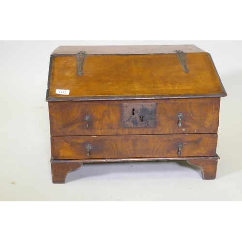 1107 - An early C18th walnut bible box with fall front and single drawer, raised on bracket supports, adapt... 