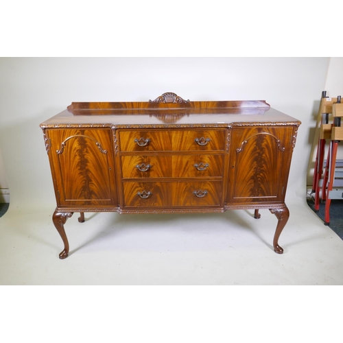 1116 - A Maples mahogany breakfront sideboard, with three drawers flanked by two doors, raised on cabriole ... 