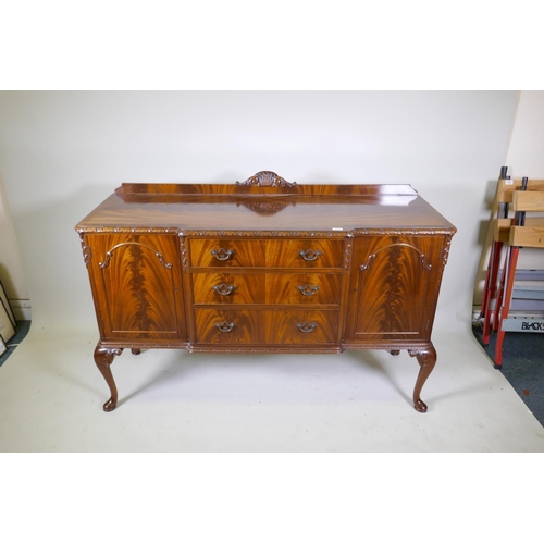 1116 - A Maples mahogany breakfront sideboard, with three drawers flanked by two doors, raised on cabriole ... 