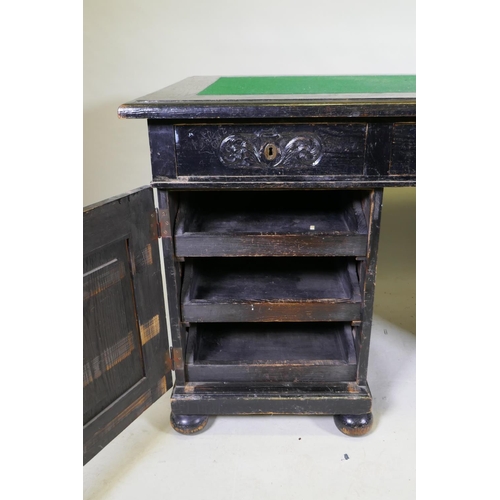 1119 - A C19th continental stained pine pedestal desk, with three drawers and two cupboards, one fitted wit... 