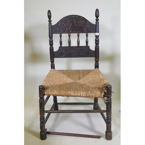 1128 - An C18th continental oak side chair, the back carved with a leaping stag and inscribed ANNO TK 1756,... 