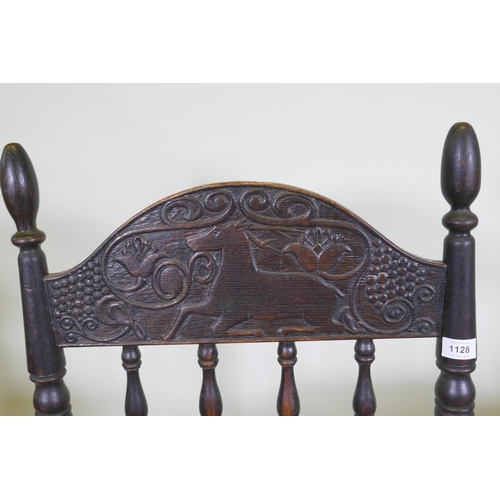 1128 - An C18th continental oak side chair, the back carved with a leaping stag and inscribed ANNO TK 1756,... 