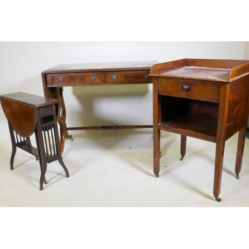 1130 - An inlaid mahogany Regency style sofa table with two drawers, raised on lyre shaped end supports, an... 