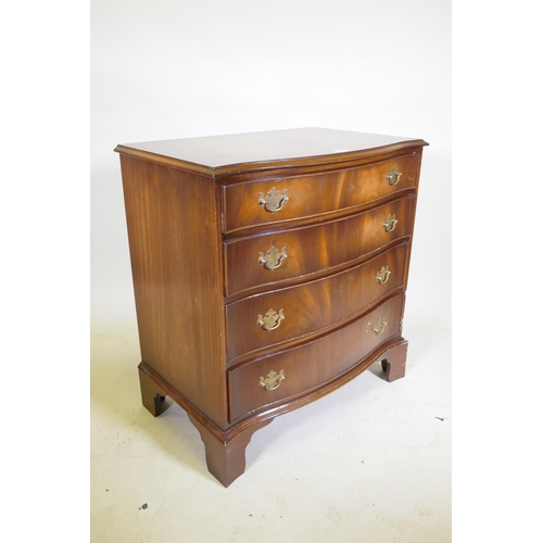 1132 - A mahogany serpentine front chest of four drawers, with brass plate handles, raised on bracket suppo... 