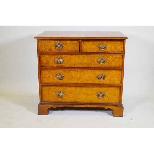 1133 - A Brights of Nettlebed burr walnut chest of two over three graduated drawers, with pierced fret bras... 