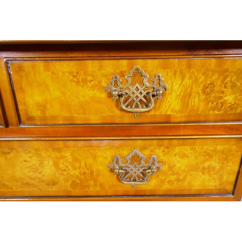 1133 - A Brights of Nettlebed burr walnut chest of two over three graduated drawers, with pierced fret bras... 