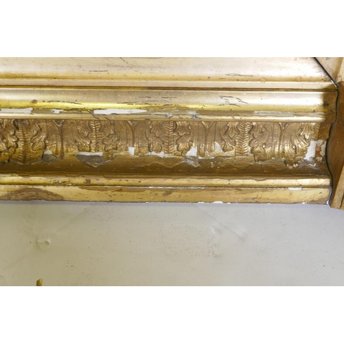 1134 - A Regency water gilt triple overmantel mirror, with raised composition decoration and original glass... 