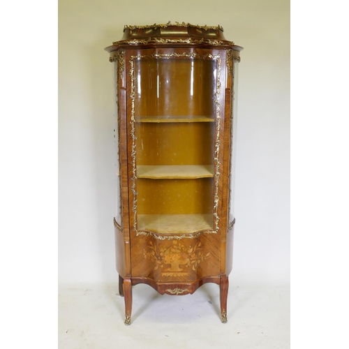 1135 - A Louis XV style marquetry inlaid rosewood vitrine with brass mounts, serpentine front, raised on sh... 