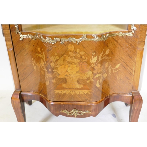 1135 - A Louis XV style marquetry inlaid rosewood vitrine with brass mounts, serpentine front, raised on sh... 