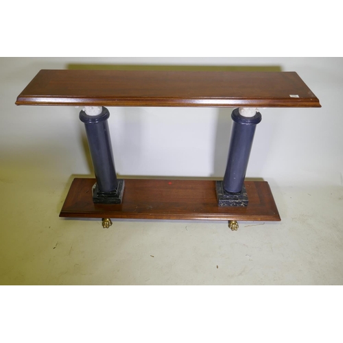 1136 - A contemporary hardwood console table, raised on two marble columns, 141 x 36 x 87cm