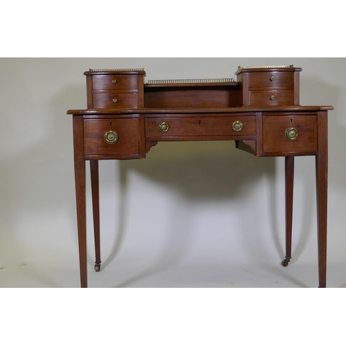 1138 - A Victorian inlaid mahogany bonheur de jour, the upper section with pierced brass gallery over four ... 