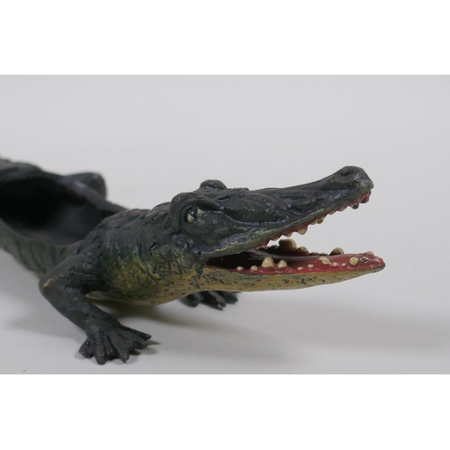 119 - A cold painted bronze pin tray in the form of a crocodile, in the manner of Bergman, 22cm long