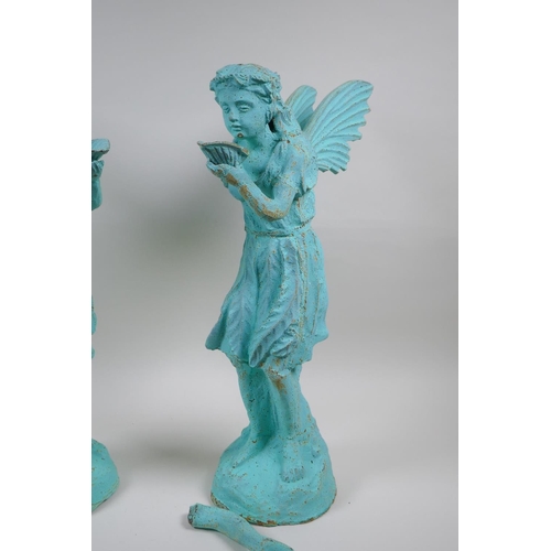 122 - A pair of cast iron garden fairies with applied verdigris patina, AF, 50cm high