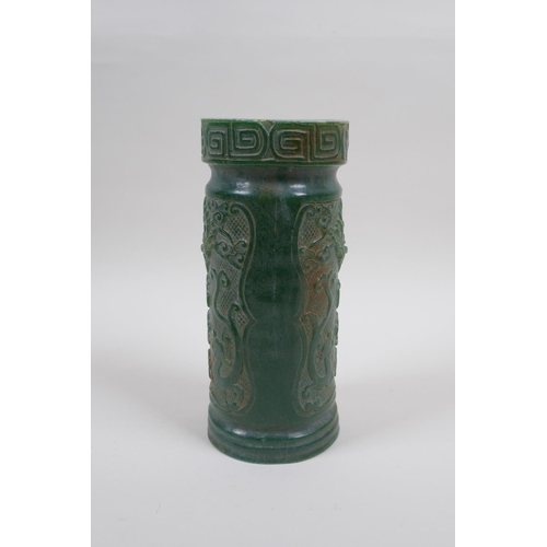 126 - A Chinese reconstituted green hardstone brush pot decorated with dragons and character inscriptions,... 