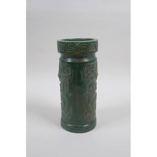 126 - A Chinese reconstituted green hardstone brush pot decorated with dragons and character inscriptions,... 