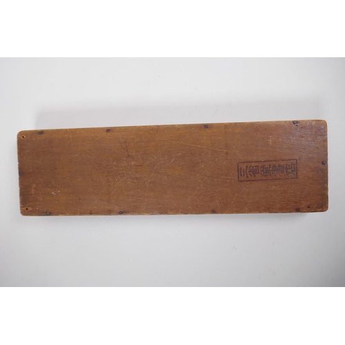 127 - A Chinese hardwood abacus with carved characters and inscription verso, 33 x 10cm