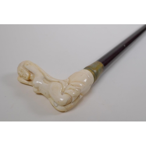 130 - A bone handled walking stick, the handle carved in the form of a female nude, 88cm long