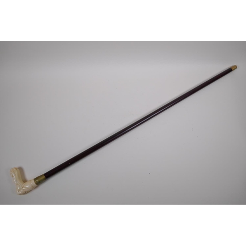 130 - A bone handled walking stick, the handle carved in the form of a female nude, 88cm long