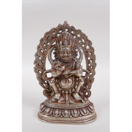 135 - A Sino Tibetan white metal figure of a wrathful deity, 16cm high