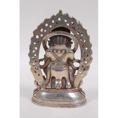 135 - A Sino Tibetan white metal figure of a wrathful deity, 16cm high