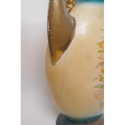 137 - A pair of Edwardian porcelain vases with gilt handles and floral decoration, 44cm high, AF