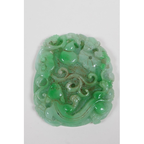 138 - A Chinese mottled green jade pendant with carved kylin, ruyi and bat decoration, 7 x 9cm