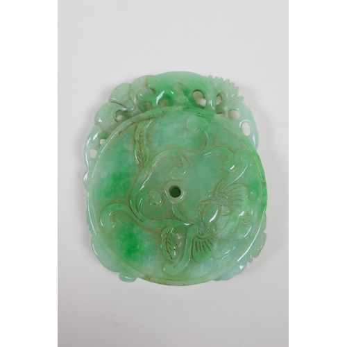 138 - A Chinese mottled green jade pendant with carved kylin, ruyi and bat decoration, 7 x 9cm