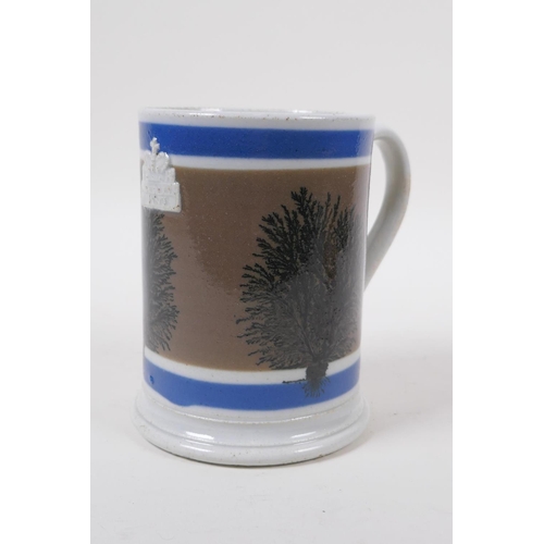 14 - An early Victorian Mocha Ware 'Imperial Pint' tankard with coloured bands and tree designs, 13cm hig... 