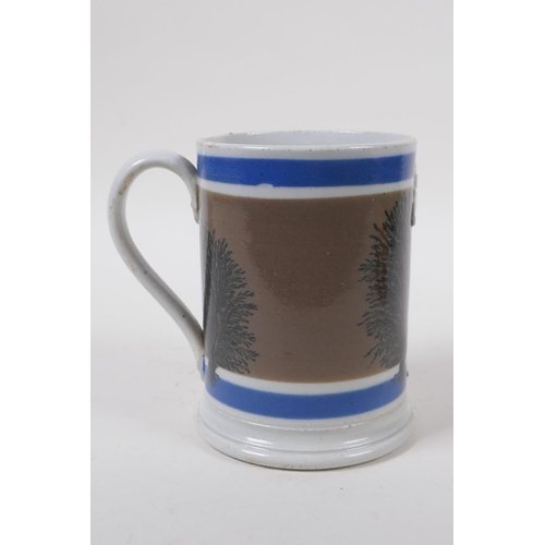 14 - An early Victorian Mocha Ware 'Imperial Pint' tankard with coloured bands and tree designs, 13cm hig... 