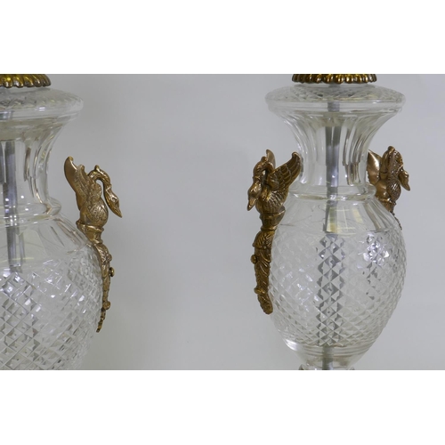 141 - A pair of glass and brass table lamps, with Empire style decoration, 64cm high