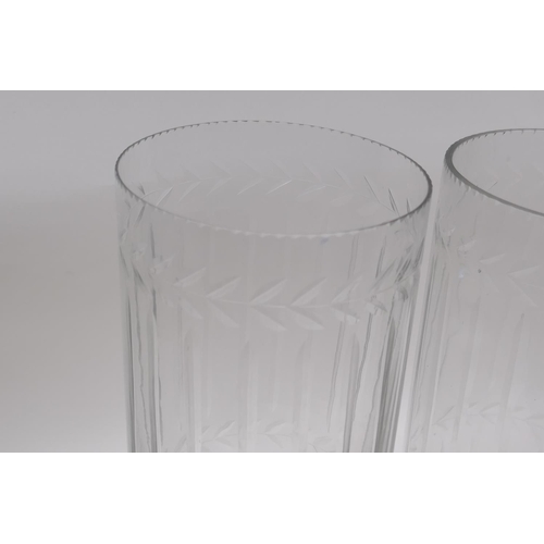 142 - A pair of glass hurricane vases with cut glass decoration, 34cm high, 12cm high