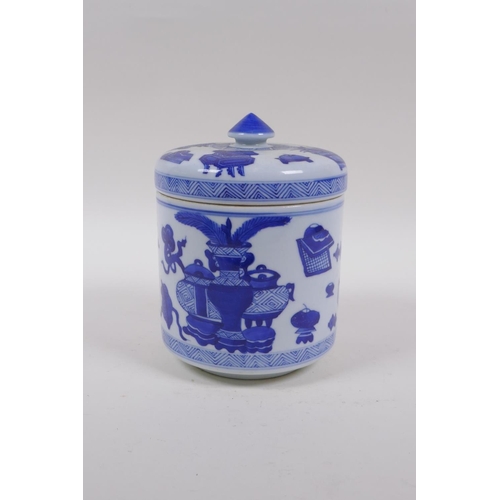 143 - A Chinese blue and white porcelain cylinder pot and cover decorated with objects of virtue, 16cm hig... 