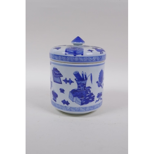 143 - A Chinese blue and white porcelain cylinder pot and cover decorated with objects of virtue, 16cm hig... 