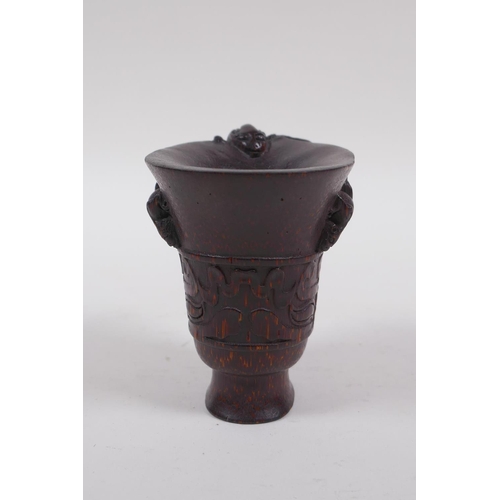 146 - A Chinese faux horn bamboo libation cup, with kylin decoration, seal mark to base, 8cm high