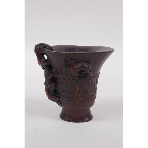 146 - A Chinese faux horn bamboo libation cup, with kylin decoration, seal mark to base, 8cm high