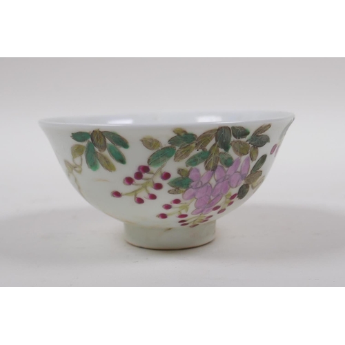 148 - An early C20th famille vert porcelain tea bowl decorated with birds amongst flowers, Chinese GuangXu... 