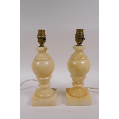 154 - A pair of carved alabaster lamps, with shades, 28cm high