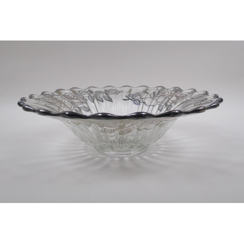 156 - A silver overlaid glass fruit bowl decorated with a rose design, 32cm diameter