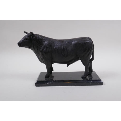 157 - A bronze patinated metal figure of a bull, in the manner of Mene, 26cm long