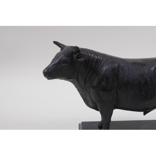 157 - A bronze patinated metal figure of a bull, in the manner of Mene, 26cm long