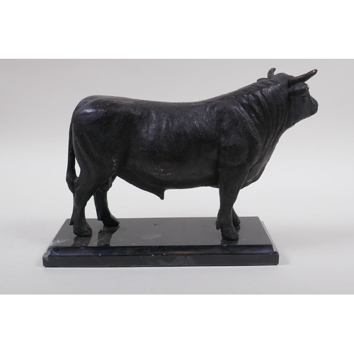 157 - A bronze patinated metal figure of a bull, in the manner of Mene, 26cm long