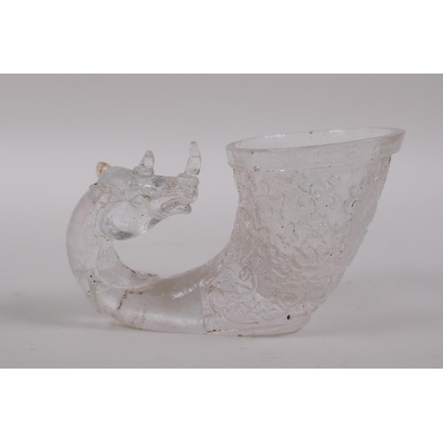 160 - A Chinese moulded glass libation cup with mythical creature decoration, 12cm long