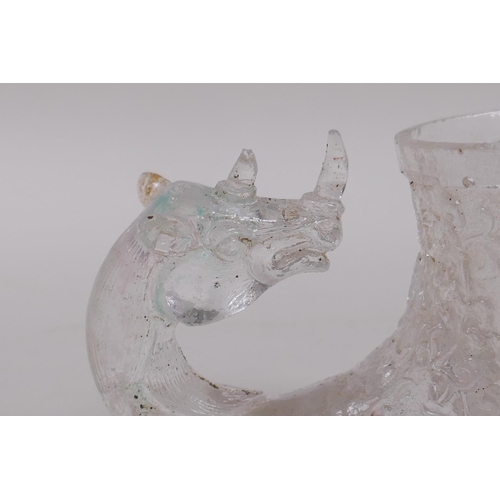 160 - A Chinese moulded glass libation cup with mythical creature decoration, 12cm long